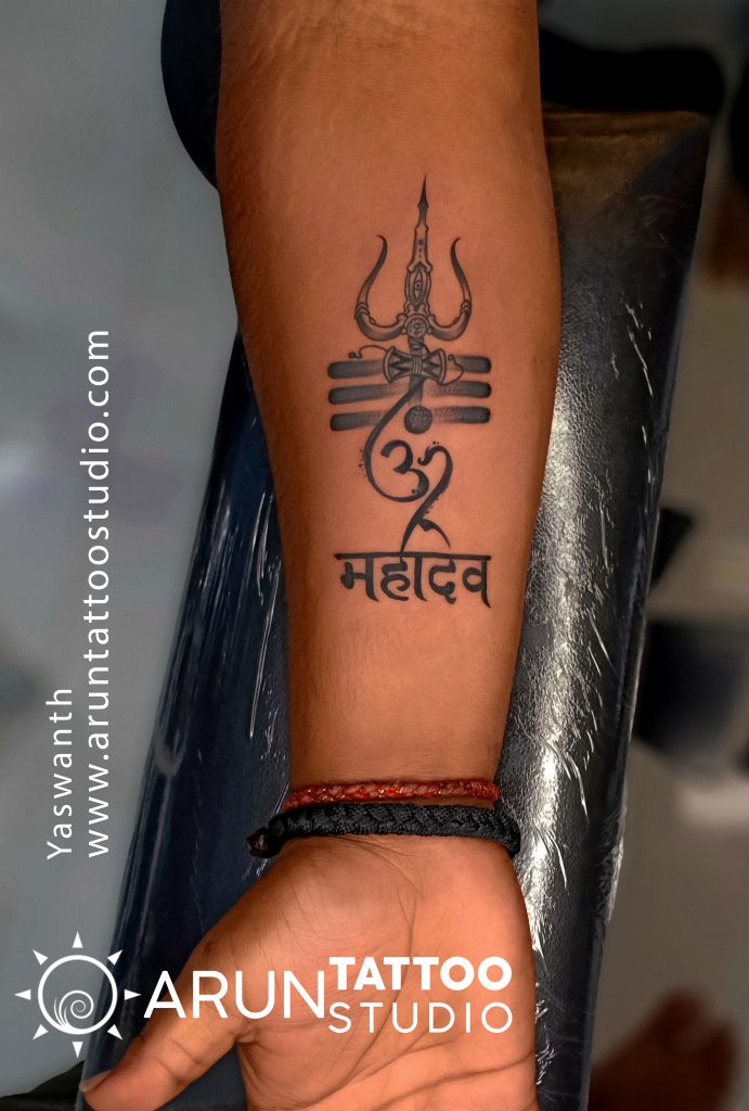 Discover Om Symbol With Trishul Tattoo on Forearm - Black Poison Tattoos
